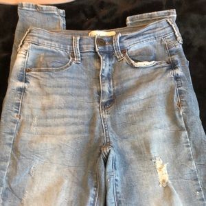 Light blue jeans with tiny rips, from Walmart im pretty sure